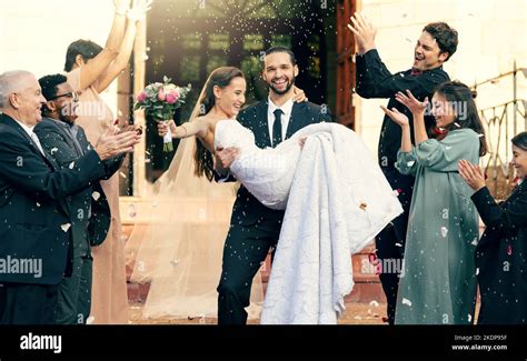Wedding, love and man carrying woman outside church fo celebration of ...