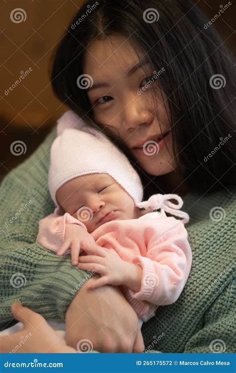 Young Happy and Attractive Asian Korean Woman Holding Her Adorable ...