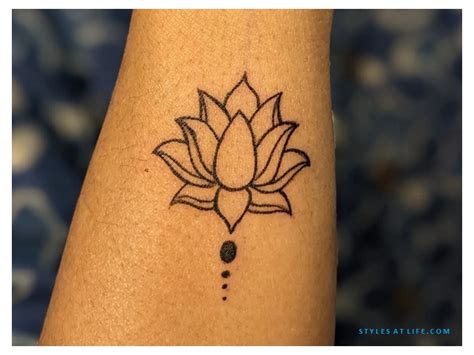 dainty lotus tattoos