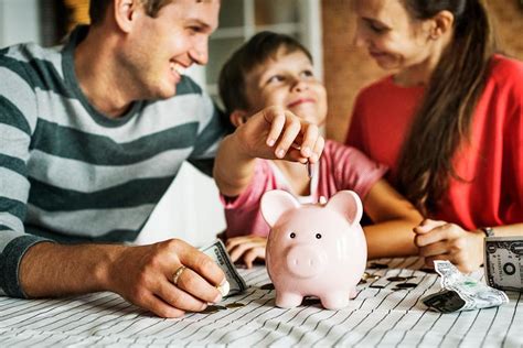 mom  son saving money  piggy bank royalty  photo