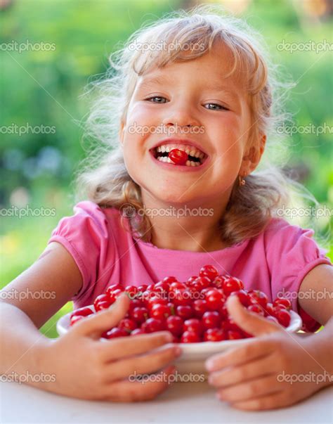 Girl with cherry Stock Photo by ©TatyanaGl 12159947