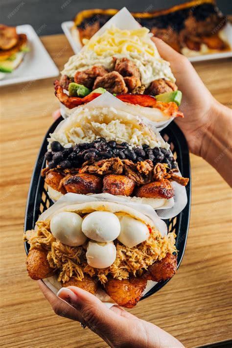 Premium Photo | Venezuelan food on a table arepas tostones cachapas