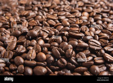 close  view    spread  dark roasted arabica coffee beans