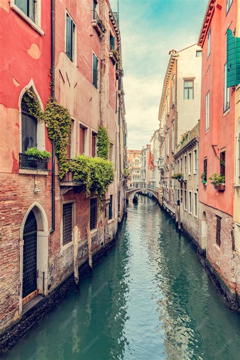 Premium Photo | Venice Italy a scenic narrow canal and historic