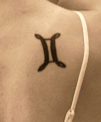 Gemini Symbol Tattoo On Neck || Tattoo from Itattooz