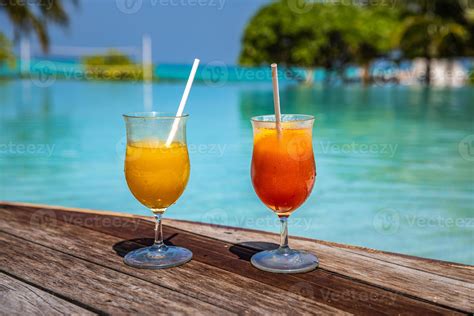 Two cocktails on luxury tropical beach resort. Couple vacation, travel