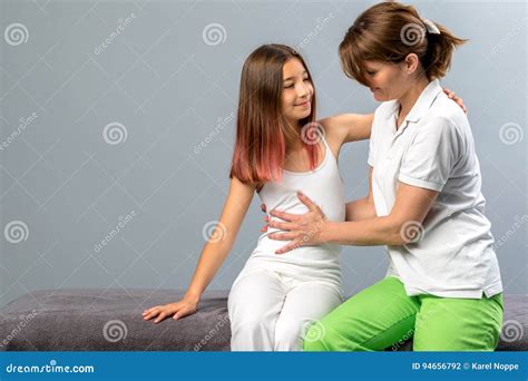 Little Girl at Osteopathic Therapy Session. Stock Photo - Image of ...