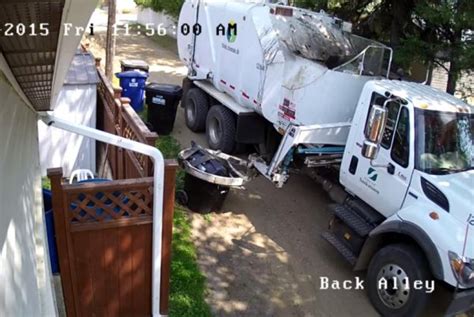 Watch: Garbage truck's hyraulic arm crushes bin - UPI.com