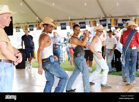 Gay men line dancing under a tent at a rodeo Stock Photo - Alamy