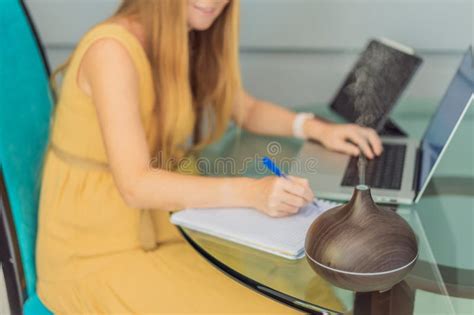 Expectant Woman Enhances Work Environment, Using an Aroma Diffuser for ...