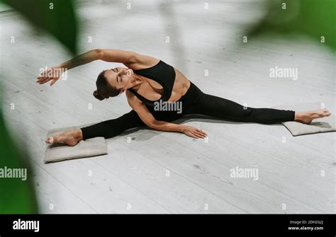 Beautiful girl training in the gym. Russian classic dancer doing stretching and yoga poses Stock ...