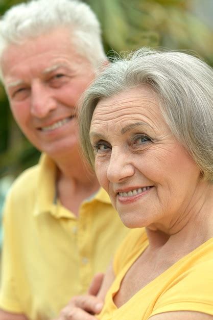 Premium Photo | Happy elderly couple embracing