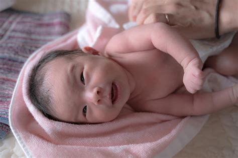 baby changing clothes premium photo