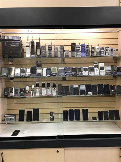 This electronics shop has a display of cell phones from way back in the