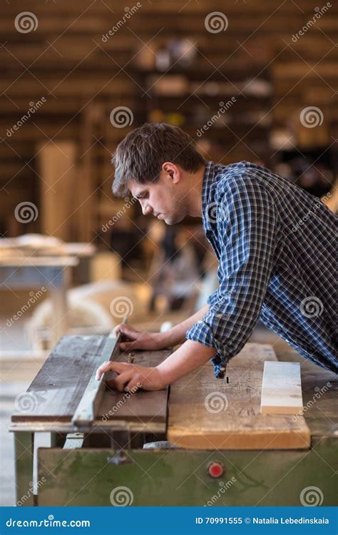 skilled carpenter working   woodwork workshop   circular