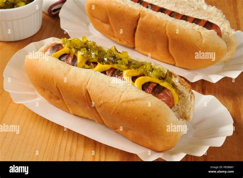 Grilled hot dogs with relish and mustard Stock Photo - Alamy