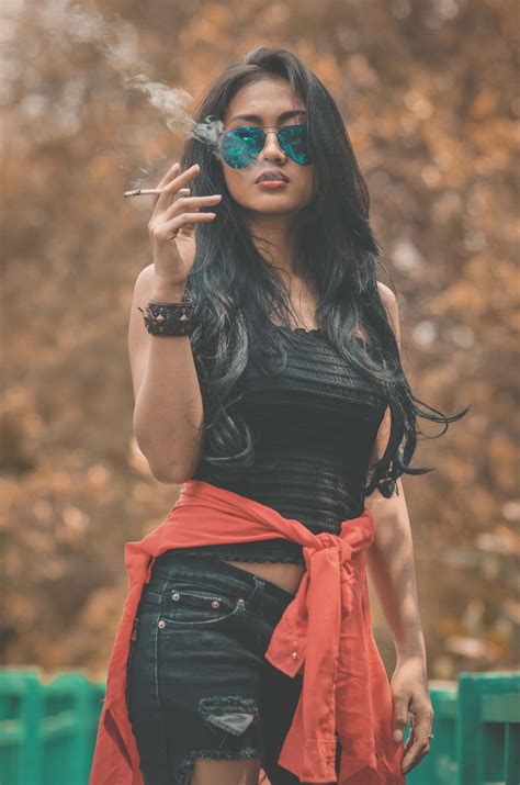 Download Woman Doing Sexy Pose With Car Wallpaper | Wallpapers.com