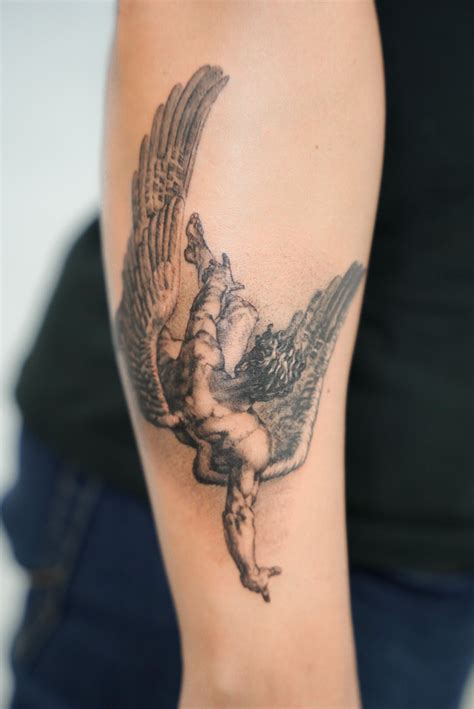 Artists explain the intricate shading of a devilish angel tattoo 30
