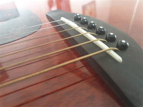 acoustic guitar action lowering  saddle  blogging musician