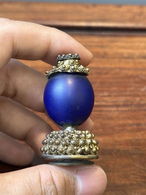 Seven Chinese gilt bronze Mandarin hat finials, Qing - Rob Michiels