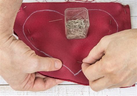 premium photo cropped hand stitching red textile