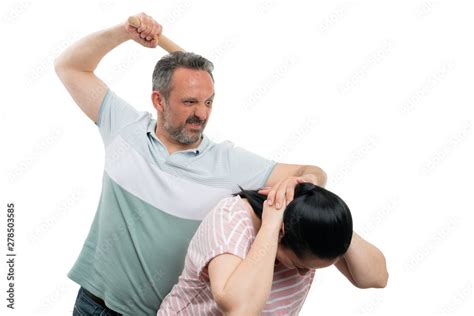 man holding woman head  hitting  stock photo adobe stock