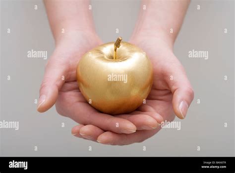 A golden apple Stock Photo - Alamy