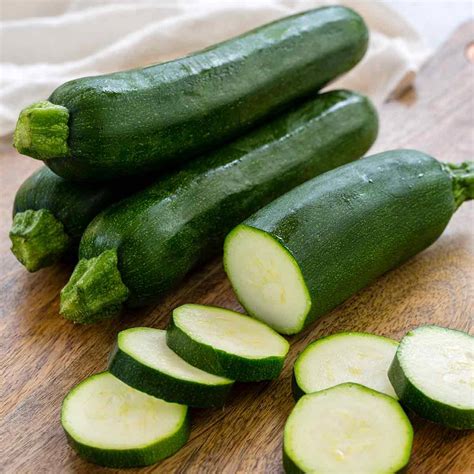 Download Caption: Fresh Zucchini Slices Showcasing White Flesh