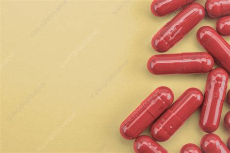 Red capsules - Stock Image - F037/1250 - Science Photo Library