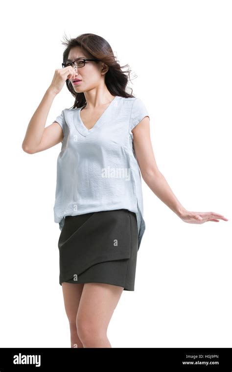 young woman holding  nose stock photo alamy