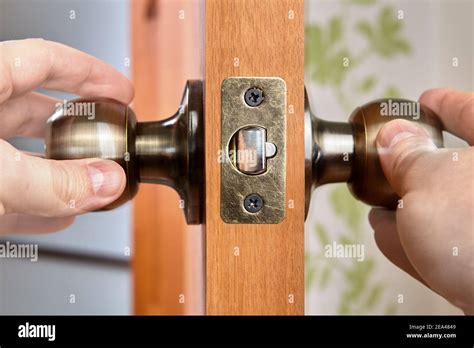 Doors latch have spring-loaded mechanism that door knob turns to ...