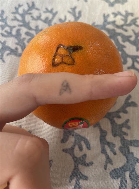 Orange grew a flaw that looks like my decade old stick-and-poke : r
