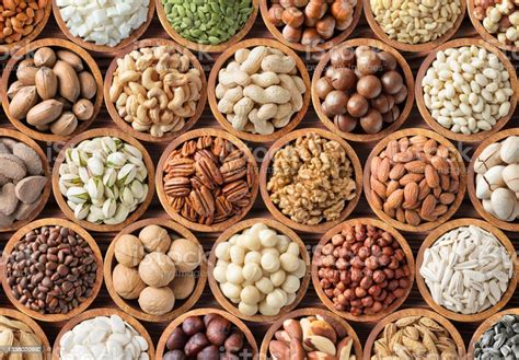 nuts background raw food  bowls top view stock photo