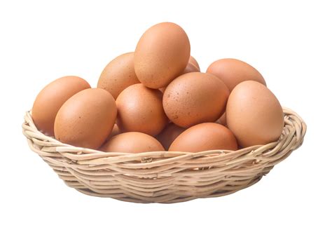 Fresh chicken eggs in woven bamboo basket isolated with clipping path ...