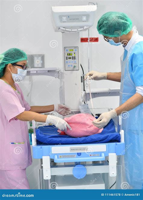 Male Obstetrician-gynecologist Working With Young Stress Woman In