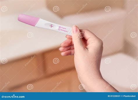 young woman checking pregnancy test stock image image  expecting