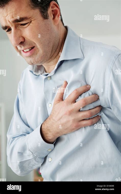 MAN WITH HEART ATTACK Stock Photo - Alamy