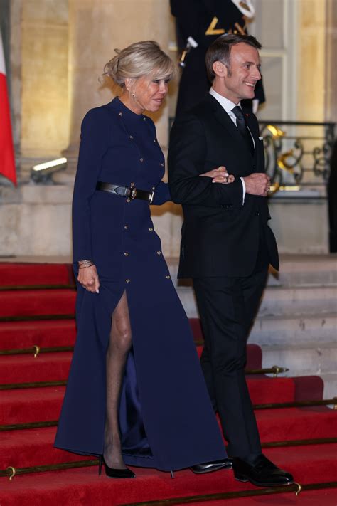 Brigitte Macron Favors Utilitarian Styling and Statement Belt in Paris