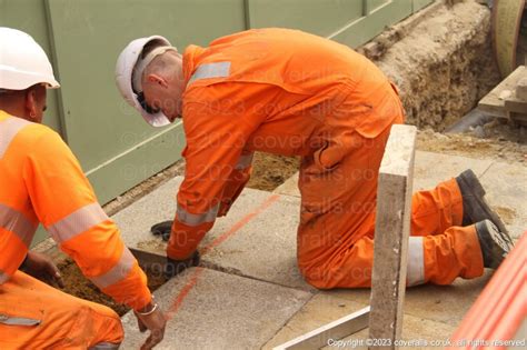 Electical Engineer Lad Wearing Portwest Bizflame Orange Boilersuit ...
