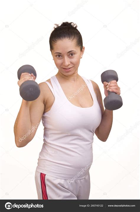 Attractive Hispanic Woman Lifting Weights Stock Photo by ©YAYImages ...