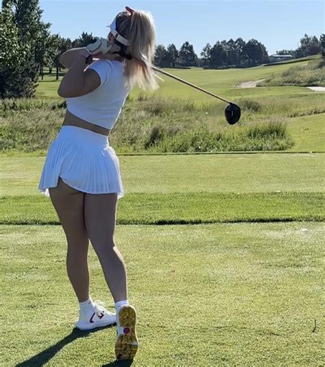 Paige Spiranac models revealing mini skirt during morning golf session