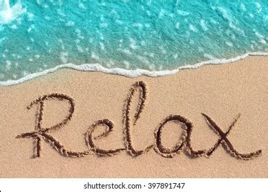 Word Relax Handwritten On Sandy Beach Stock Photo (Edit Now) 409893253