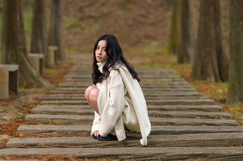 model, women, Asian, brunette, squatting, women outdoors, sweater