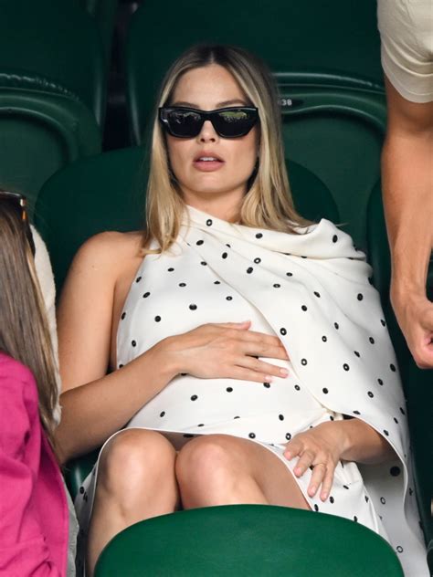 Pregnant Margot Robbie dresses her baby bump in polka dots at Wimbledon