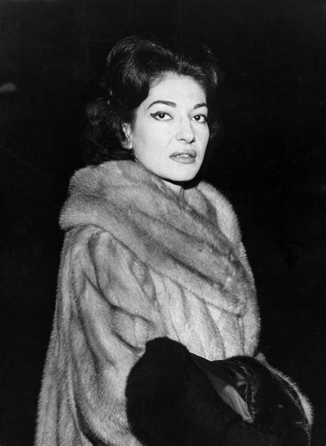 an old photo of a woman wearing a fur coat