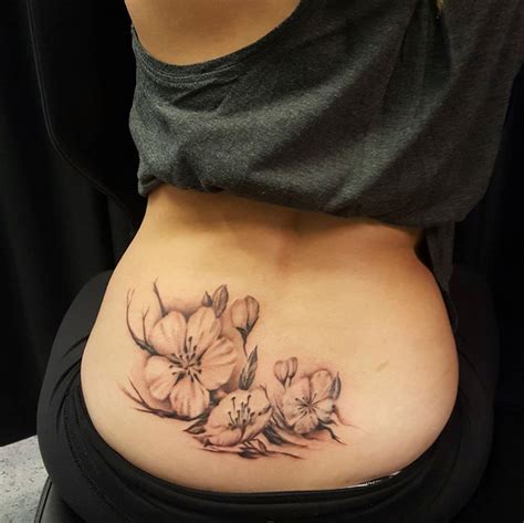 Chronic Ink Tattoo - Toronto Tattoo Lower back flower cover up tattoo ...