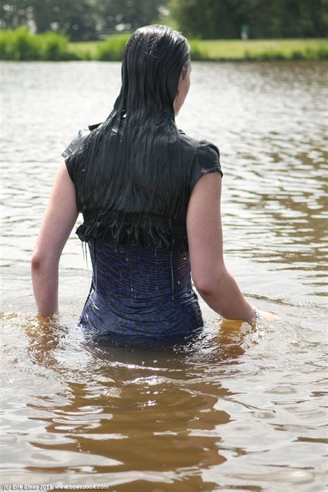 WWF 56035 - Playing with a garden hose in white skirt & leggings ...