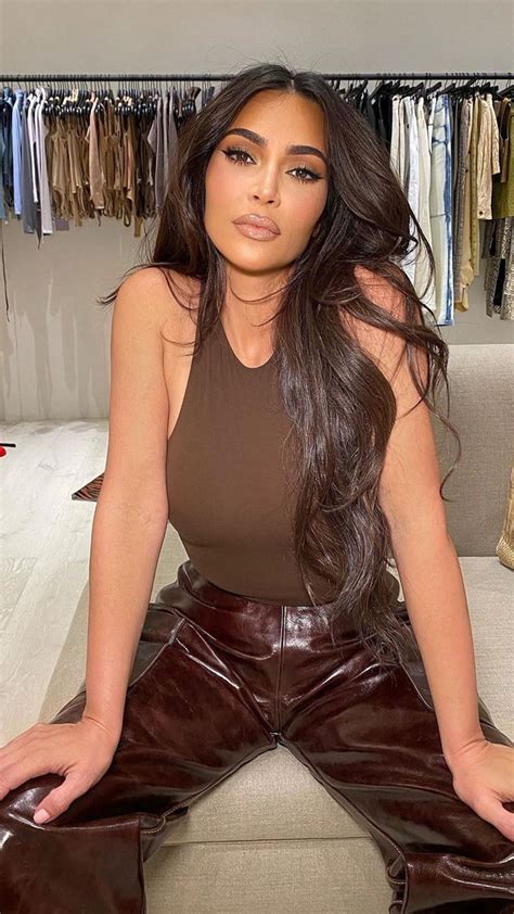 Kim Kardashian shows off her curves in skintight black bodysuit and cut ...