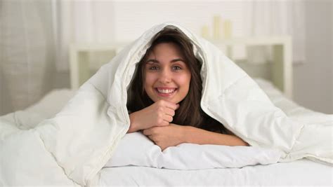 Cute Woman Under Covers In Bed Stock Footage Video 3551816 - Shutterstock