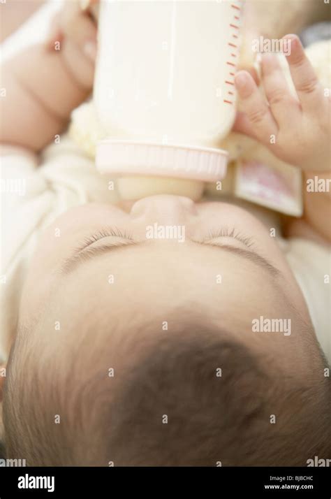 Baby drinking milk Stock Photo - Alamy